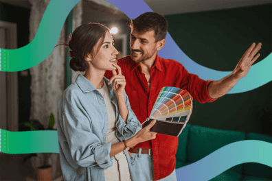 A happy couple decides paint colors after securing a home equity loan from RadiFi Credit Union.