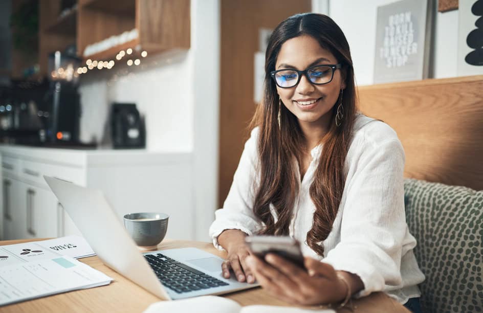 Person using a smartphone to join RadiFi Credit Union online with nationwide membership eligibility